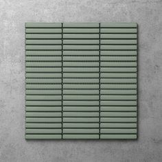 a square tile with vertical lines on it