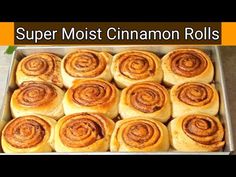 a pan filled with cinnamon rolls sitting on top of a counter