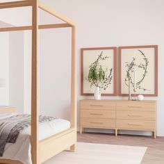 a bed room with a neatly made bed and two paintings on the wall above it