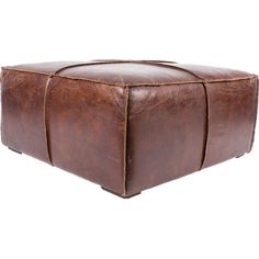 a large brown leather ottoman sitting on top of a white floor