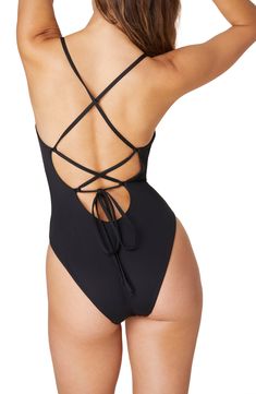 This timeless one-piece features a classic silhouette and an adjustable lace-up back for the perfect fit. Cheeky back coverage   80% recycled nylon, 20% spandex   Hand wash, dry flat   Imported Elegant Solid Color Low Back Swimwear, Fitted Low Back Swimwear With Back Opening, Summer Swimwear With Lace-up And Strappy Back, Strappy Lace-up Back Swimwear For Summer, Strappy Back Lace-up Swimwear For Summer, Fitted One-piece Swimwear With Back Opening, Backless Lace-up Swimwear For Beach, Fitted V-back Swimwear For Poolside, Backless Lace-up Beach Swimwear