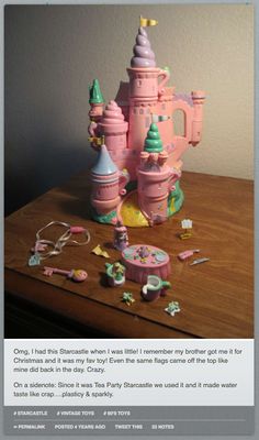 there is a pink toy castle on the table with other toys and decorations around it