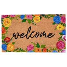 a welcome mat with flowers and the word welcome written on it in black lettering,