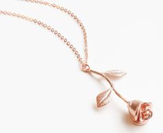 This standard single charm necklace is featured in rose gold tone and is available with a size 20" chain. Rose Gold Charm Necklace With Flower Pendant, Valentine's Day Rose Gold Necklaces With Rose Design, Rose Gold Flower Pendant Charm Necklace For Valentine's Day, Dainty Rose Gold Charm Necklace With Rose Design, Rose Gold Copper Necklace As Gift, Single Rose, Size 20, Charm Necklace, Gold Tones