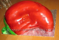 a cake shaped like a large red pepper