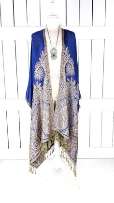 Handmade blue floral pashmina kimono cover up jacket with custom regular and maxi lengths and optional fringe detail Measurements...taken flat - width across seam to seam: 46"  - length in photo with 4" fringe:  54" - Maxi length is as selected with or without fringe Features... - lovely soft woven medium weigh pashmina fabric - bohemian oversized flowing design - cardigan style with an open front and generous arm holes  - universal design allows a comfortable fit for small through plus sizes - Bohemian Long Shawl For Spring, Spring Bohemian Long Shawl, Summer Shawl With Tassels, Elegant Winter Shawl With Tassels, Elegant Tasseled Shawl For Winter, Bohemian Fringe Shawl For Spring, Spring Blue Kaftan With Tassels, Blue Tassel Kaftan For Spring, Bohemian Kaftan With Tassels And Traditional Drape