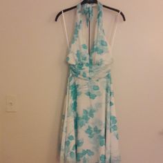 Nwot Floral Halter Dress. Tie Around Neck, Zipper In Back. Knee Length. Perfect For Summer Weddings, Vacations Or Night Out. Never Worn. This Dress Is Super Cute. 100% Polyester. Turquoise Blue And White. White A-line Dresses, White Halter Dress For Summer Formal, White Formal Halter Dress For Summer, Summer Formal White Halter Dress, White Halter Neck Dress For Garden Party, White Summer Formal Halter Dress, White Fitted Halter Dress With Floral Print, Fitted White Halter Dress With Floral Print, Fitted Blue Floral Print Halter Dress