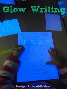 a child is writing on a sheet of paper with the words glow writing in front of them