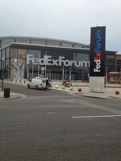 an empty parking lot in front of a fedex forum