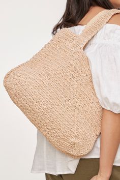 STYLE DETAILS: Get ready to take on all your summer adventures with the trusty Palme Bag by your side! Each woven carry-all is handcrafted with care, adding a special touch to your ensemble. With long shoulder straps and a spacious interior, you can comfortably carry large items like water bottles, smart tablets, or beach towels. Wherever you go, this bag has got you covered! FEATURES: Tote bag Long shoulder straps Handcrafted Zipper with tassel Cotton, Paper Raffia 30cm x 25cm Natural Color Pouch Shoulder Bag For Vacation, Natural Pouch Shoulder Bag For Vacation, Summer Hobo Bag With Braided Handles And Pouch Shape, Beige Pouch Beach Bag For Summer, Summer Hobo Pouch Bag For Daily Use, Summer Hobo Bag For Daily Use, Summer Casual Pouch Hobo Bag, Summer Straw Pouch Bag With Adjustable Strap, Summer Beige Pouch Beach Bag