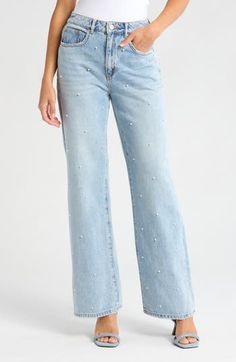 An imitation pearl embellishment channels glam rock on these faded straight-leg jeans cut from nonstretch denim in a wide-leg silhouette. 31" inseam; 23" leg opening; 12 1/2" front rise; 16" back rise (size 29) Zip fly with button closure Five-pocket style 100% cotton Machine wash, line dry Imported Glamorous Straight Leg Denim Bottoms, Trendy Straight Leg Flare Jeans With Rhinestones, Rhinestone Denim Flare Jeans Straight Leg, Glamorous Straight Leg Jeans For Spring, Embellished High Rise Denim Jeans, High Rise Embellished Denim Jeans, Spring Embellished Straight Leg Bottoms, Spring Embellished Flare Denim Jeans, Embellished Straight Leg Bottoms For Spring