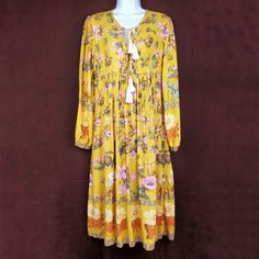 R. Vivimos Tassel Floral Boho Midi Dress In Mustard Yellow, Cream, And Pink. Long Sleeves. Gathered Sleeves. No Stains Or Holes. Flowy Boho Bohemian Dress. Farmcore Dress. No Material Tag. Size: M / 8 / 10 Length: 45" Pit To Pit: 18" Sleeve: 24" Waist: 17" Condition: New With Tag Box N D Yellow Bohemian Maxi Dress For Fall, Yellow Tassel Beach Dress, Yellow Floral Print Maxi Dress For Festival, Yellow Bohemian Dress For Fall, Yellow Bohemian Fall Dress, Yellow Floral Print Dress For Festival, Yellow Bohemian Dress With Tassels, Yellow Long Sleeve Bohemian Dress, Vintage Halter Dress