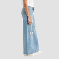 Elevate your wardrobe with the timeless charm of the Levi's® Women's Mid-Rise 94's Baggy Wide Leg Jeans in the captivating 'Not In The Mood' blue shade. These jeans are a nod to the iconic '90s fashion, offering a stylish and relaxed silhouette that transcends time.

- Style: Mid-rise, baggy, wide-leg
- Color: Blue
- Gender: Female
- Age Group: Adult
- Material: Denim

Crafted with the exceptional quality and craftsmanship that Levi's® is renowned for, these jeans are designed to be more than ju Retro Baggy Mid-rise Jeans, Retro Wide Leg Bottoms With Frayed Hem, Retro Wide-leg Bottoms With Frayed Hem, Vintage High Rise Baggy Flare Jeans, 90s Wide Leg Flare Jeans With Five Pockets, Baggy High Rise Vintage Flare Jeans, Vintage High-rise Baggy Flare Jeans, Retro Baggy Full-length Jeans, Spring Streetwear Flare Jeans