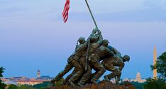 a statue with the american flag on top of it