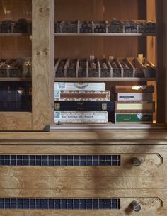 a book shelf filled with books next to a wooden cabinet full of other books and knick - knacks