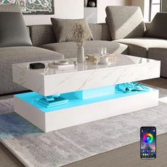 a modern coffee table with blue led lights