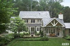 a house that is in the middle of some grass