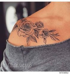 a woman's shoulder with roses on it