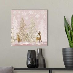 two deer standing in front of a forest with snowflakes on the trees and pink background