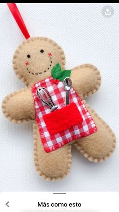 an ornament made to look like a ginger holding a red and white checkered bag