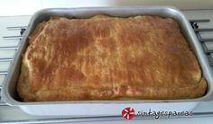 a pan filled with food sitting on top of a stove