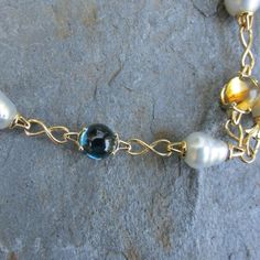 14KT yellow gold Paspaley South Sea Pearl, citrine, amethyst + blue topaz station chain lariat necklace. Wear as a lariat or wear it long- choose your length to wear it at! Length: 25" Lobster clasp (10) 10mm Paspaley pearls; "Fashion" quality; "Circle" shape; "Aquarella" collection (1) 11mm Paspaley pearl (4) 10mm cabochon blue topaz (3) 10mm cabochon citrine (3) 10mm cabochon amethyst Weight: 69.6g Made to order: please allow 7-10 business days prior to shipping Elegant Gold Lariat Necklace With Natural Stones, Pearls Fashion, Sea Pearl, Sea Pearls, South Sea Pearls, South Seas, Circle Shape, Lariat Necklace, Blue Topaz