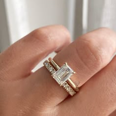 Simple Engagement Ring Rectangle, Double Banded Emerald Cut Ring, Luxury Minimalist Square Cut Ring, Gold Rectangle Engagement Ring With Extra Band, Gold Square Engagement Ring Three, Emerald Cut Diamond Rings With Gold Band, Emerald Cut Engagement Ring Real, Luxury Minimalist Wedding And Engagement Styles, Luxury Minimalist Wedding And Engagement