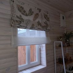 an open window in a wood paneled room