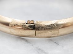 This vintage bracelet is in excellent condition, with very little wear to the engraved dome and a soft, gentle finish.Metal: 14K Yellow Gold Width: 8.3 mmInside Diameter: 6 1/2 Inches Marks: "14KP" Stamped on the clasp Channel Set Diamond Band, Engagement Ring Diamond Cut, Blue Tourmaline, Vintage Bracelet, Diamond Drop Earrings, Diamond Drops, Oval Cut Diamond, European Cut Diamonds, Art Deco Diamond