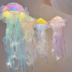 a group of jellyfish hanging from the ceiling