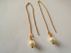 "Tiny creme colored pearls hang from the bottom of gold chain. These are gold threader chain earrings that slide through ear and hang beautifully. Gold chain threader earring measures approx. 4\" with the pearl. you can slide these easily through ear and adjust how you would like the length to hang. Earrings will come in gift box and bow ready for gift giving. Enter back into store: rhondastreasures.etsy.com" Gold Pearl Earrings With Delicate Chain, Gold Pearl Earrings With Adjustable Chain, Gold Dangle Pearl Threader Earrings, Gold Pearl Dangle Threader Earrings, Hang Earrings, Pearl Threader Earrings, Chain Threader Earrings, Earrings Pearl Drop, Colored Pearls