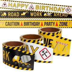 construction birthday party decorations with caution tape and stickers on the back of each roll