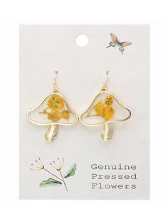 These fun vintage-inspired mushroom earrings feature yellow dried flowers embedded in clear acrylic with a gold border. Gold tone details and ear wires. 1.25" long. More Pressed flower jewelry here --> Gold Flower Charm Earrings For Summer, Gold Drop Flower Earrings For Summer, Gold Flower Earrings For Summer, Whimsical Gold Mushroom Earrings, Whimsical Gold Earrings With Mushroom Design, Gold Birth Flower Jewelry For Summer, Whimsical Gold Flower-shaped Earrings, Whimsical Spring Gold Jewelry, Whimsical Gold Jewelry For Spring