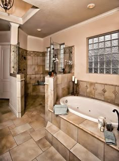 a bath room with a large tub and a sink