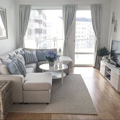 a living room filled with furniture and a flat screen tv