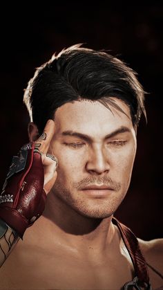 a close up of a person holding a cell phone to his ear and wearing red gloves