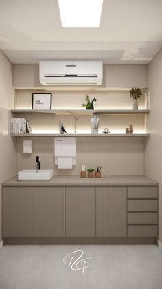 an empty kitchen with white appliances and beige cupboards on the wall above it is a skylight that illuminates light