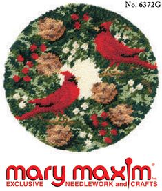 the cross stitch pattern depicts two cardinals on a holly wreath