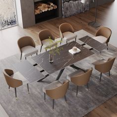 a dining room table with chairs and a fire place in the backround behind it