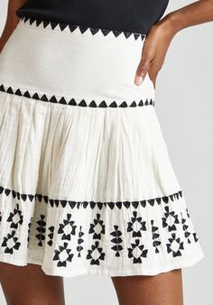 Our stunning Estella embroidered mini skirt in cream with black geometric embroidery. This mid-weight cotton style finishes above the knee fastened with a concealed side zip. Pair with our Biba vest top a pair of leather sandals for ease. Crafted in 100% cotton  Made in India  Machine Wash Contemporary Clothes, Maxi Dress Wedding Guest, Statement Outfit, Geometric Embroidery, Balloon Sleeve Top, Maxi Dress Wedding, Jacquard Dress, Maxi Dress Evening, Embroidered Clothes