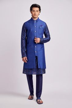 Cobalt blue sleeveless sherwani jacket with all over griffin print.
Components: 1
Pattern: Print
Type Of Work: Griffin
Neckline: Stand Collar
Sleeve Type: Sleeveless
Fabric: Flat Raw Silk
Color: Blue
Other Details: 
Note: Inner kurta, sailor brooch, pant and pocket square worn by the model is not for sale
Occasion: Cocktail and Reception - Aza Fashions Royal Blue Sherwani For Eid, Fitted Blue Nehru Jacket For Diwali, Fitted Blue Outerwear For Designer Wear, Blue Fitted Outerwear For Designer Wear, Fitted Blue Nehru Jacket For Designer Wear, Fitted Blue Nehru Jacket For Designer Events, Royal Blue Fitted Nehru Jacket, Designer Blue Nehru Jacket For Diwali, Designer Blue Nehru Jacket For Eid