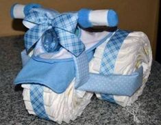 a blue and white cloth diaper on top of a counter next to a bottle