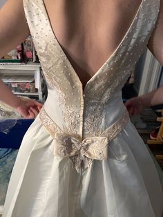 the back of a woman's wedding dress