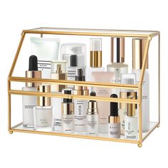 a gold metal shelf filled with different types of skin care products