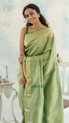 This green Kanchipuram silk saree has vazhaipoo vari all over the body and zari buttas on the border, while the pallu is adorned with many zari motifs such as thamari, pavuni, and manga. Green Kanchipuram Silk Saree, Sarees For Wedding, Silk Sarees Online Shopping, Bridal Silk Saree, Kanjivaram Sarees, Kanchipuram Silk Saree, Silk Sarees Online, Traditional Wear, Deep Teal