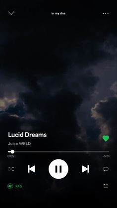 an iphone screen with the music player on it's side and clouds in the background