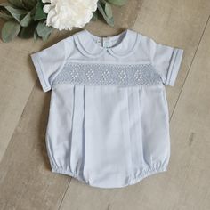 This Baby Boy's Blue Smocked Romper Is A Classic!! The Peter Pan Collar And Sleeve Cuffs Have Hand-Faggoting (A High-End Stitch Found On Heirloom Clothing). The Smocked Bodice Features Diamond Shaped Embroidery. A Small Lattice Design Is Done In A Blue Embroidery And A White Chevron Design Borders The Top And Bottom Of The Smocked Panel. Five Diamond Shapes Spaced Evenly Across The Smocking, Are Done In French Bullion Knots. A Matching Piping Trims The Top And Bottom Of The Smocked Panel. Four P Newborn Baby Dresses, Smocked Romper, English Wedding, Baby Fits, Infant Clothing, Lattice Design, Blue Embroidery, Chevron Design, Toddler Boy Outfits