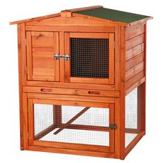 a large wooden rabbit hutch with a green roof and two doors on the front