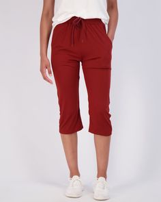 DESIGN: Our Women's Soft Capri Joggers are designed with a trendy and modern twist, featuring a cuff hem and a drawstring waist that provides the perfect fit for any size. The wide leg and cuffed hem make these joggers perfect for a range of activities from running, yoga, to lounging at home. BENEFITS: Whether you're looking for Women Running Bottoms for your active lifestyle or just comfortable pants to wear at home, our Capri Joggers have got you covered. Made from soft and warm material, thes Casual Elastic Waistband Knee-length Capris, Fall Cropped Leg Capris With Elastic Waistband, Casual Knee-length Capris For Fall, Casual Fall Capri Pants, Sporty Summer Capris With Elastic Waistband, Relaxed Fit Capris For Fall, Sporty Cotton Capris, Knee-length Solid Bottoms With Drawstring, Knee-length Drawstring Solid Bottoms