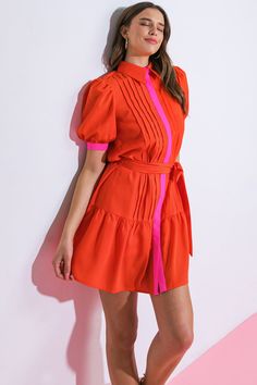 Experience luxury and sophistication in our exquisite READY WHEN YOU ARE WOVEN MINI DRESS. This stunning dress is designed with a shirt collar, hidden button down, short puff sleeves, a self sash tie, and a beautiful ruffled hemline. Elevate your style with this must-have piece that exudes elegance and exclusivity. Details:Self : 95% Polyester 5% SpandexContrast : 95% Polyester 5% SpandexLining : 100% PolyesterSize & Fit- Model is 5`8" And Wearing Size Small- Measurements Taken From Size Small- Flirty Short Sleeve Formal Dress, Summer Party Short Sleeve Shirt Dress, Summer Party Shirt Dress With Short Sleeves, Party Short Sleeve Shirt Dress, Summer Party Dress With Collared Neckline, Fitted Shirt Dress With Puff Sleeves, Fitted Short Sleeve Shirt Dress For Dress Down, Fitted Short Sleeve Shirt Dress For Casual Occasions, Elegant Orange Short Sleeve Dress